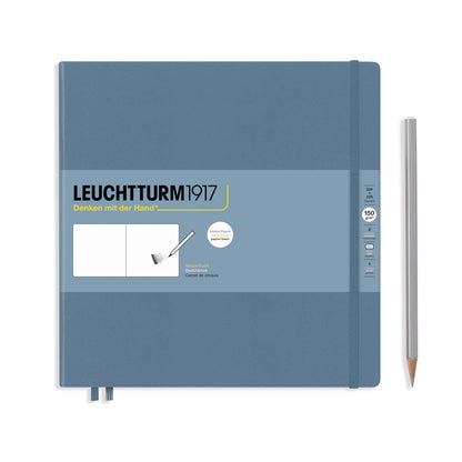 Blue notebook with Leuchtturm1917 branding and a pencil on a white background