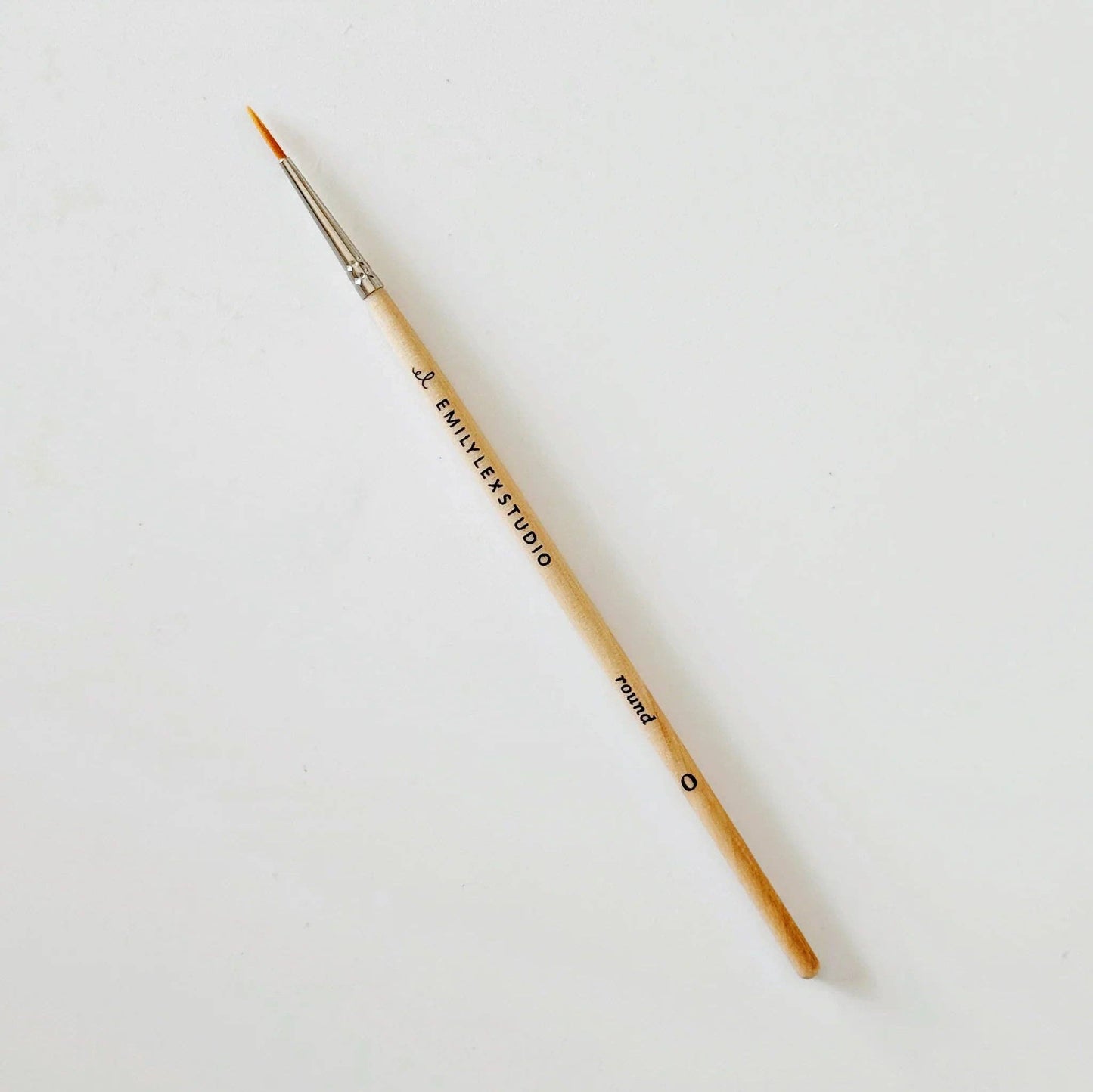 Paintbrush with 'J. Emily Studio' branding on a white background