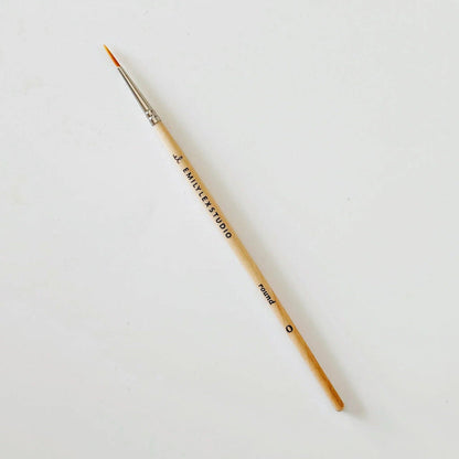 Paintbrush with 'J. Emily Studio' branding on a white background