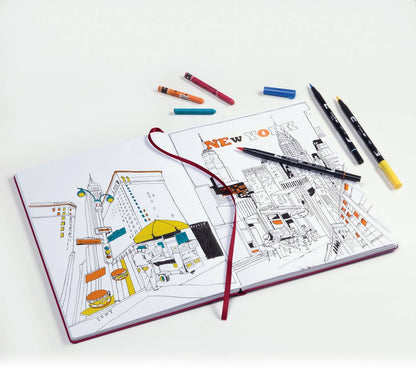 Coloring book with New York City illustration and markers on a white background