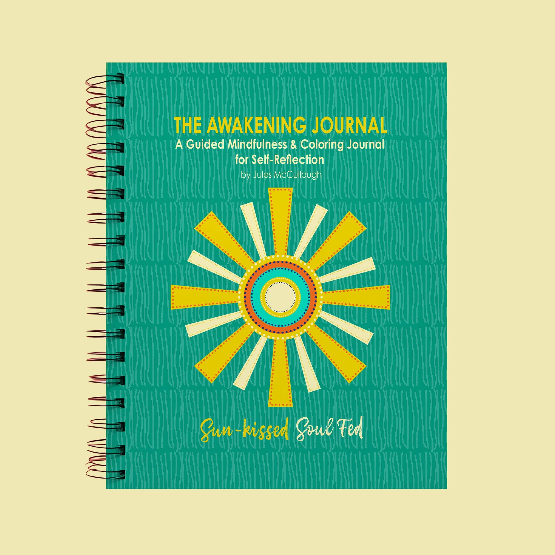 Journal titled 'The Awakening Journal' with a sun design on a beige background