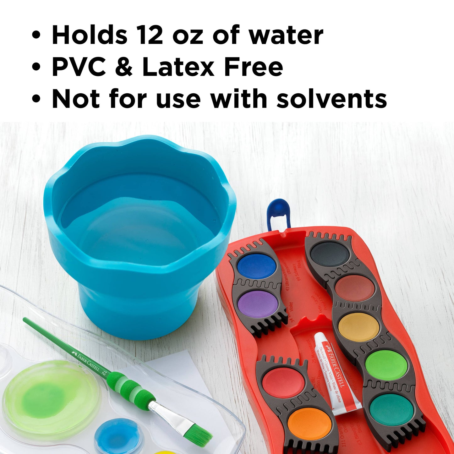 Blue plastic cup, red paint palette with colorful paint pads, and a green brush on a white background.