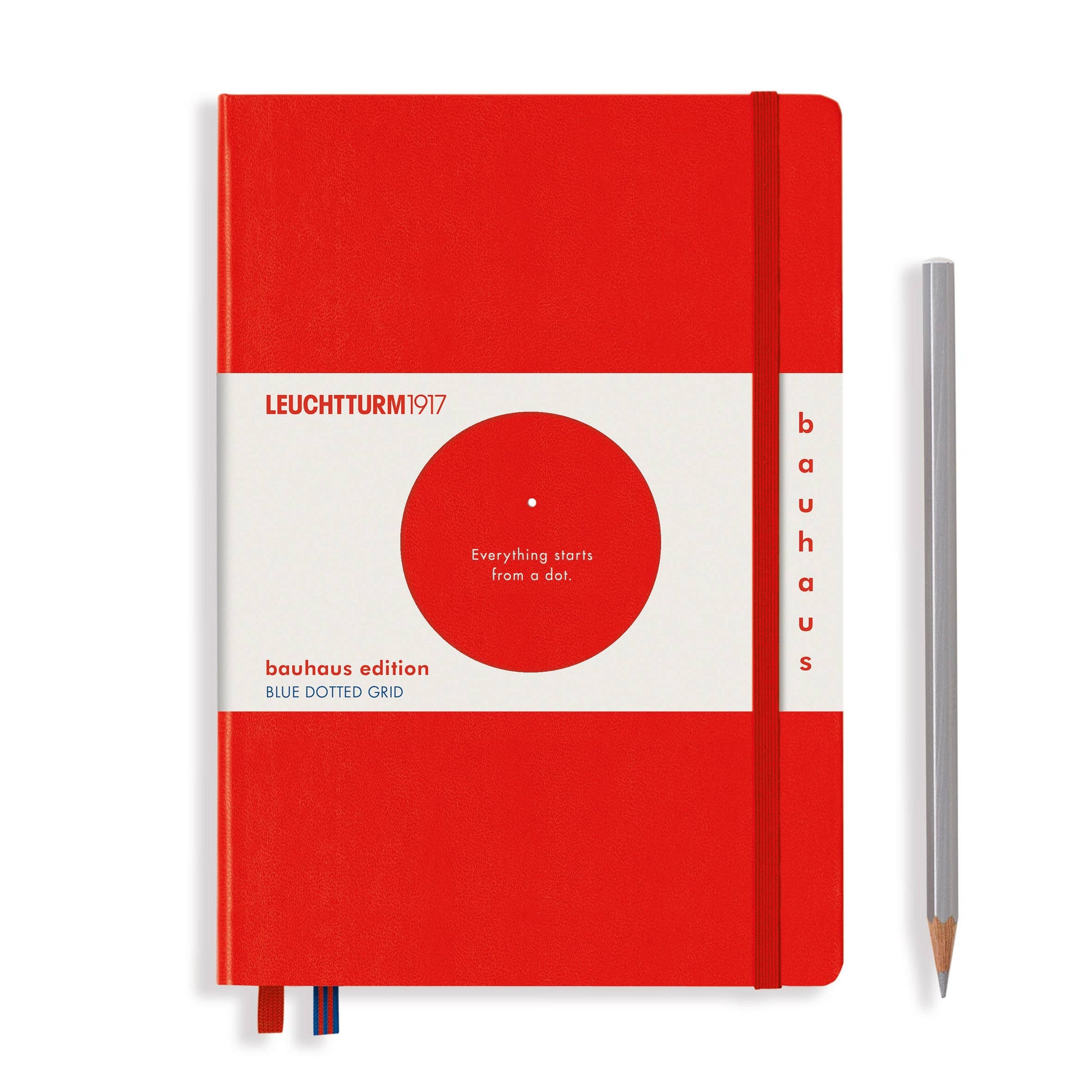 Red notebook with white cover featuring Leuchtturm1917 branding and a pencil on a white background