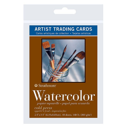 Strathmore watercolor artist trading cards packaging with brushes in a jar on a white background