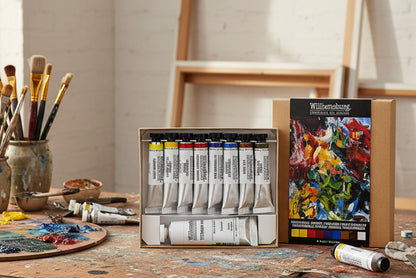 Set of Williamsburg oil paint tubes with a colorful painting on the box.